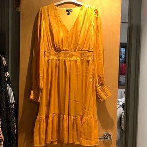 Aqua from Bloomingdale’s gold dress